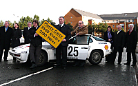 Left to right Derek Palmer ( Manager of Speed Scotland,World 1,000cc land speed Record),Provost Denis Agnew and Douglas Anderson. Background are the West Dunbartonshire Councillors
